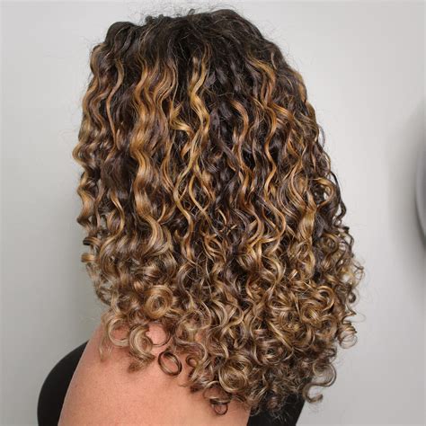 balayage on dark brown hair|balayage natural curly brown hair with blonde highlights.